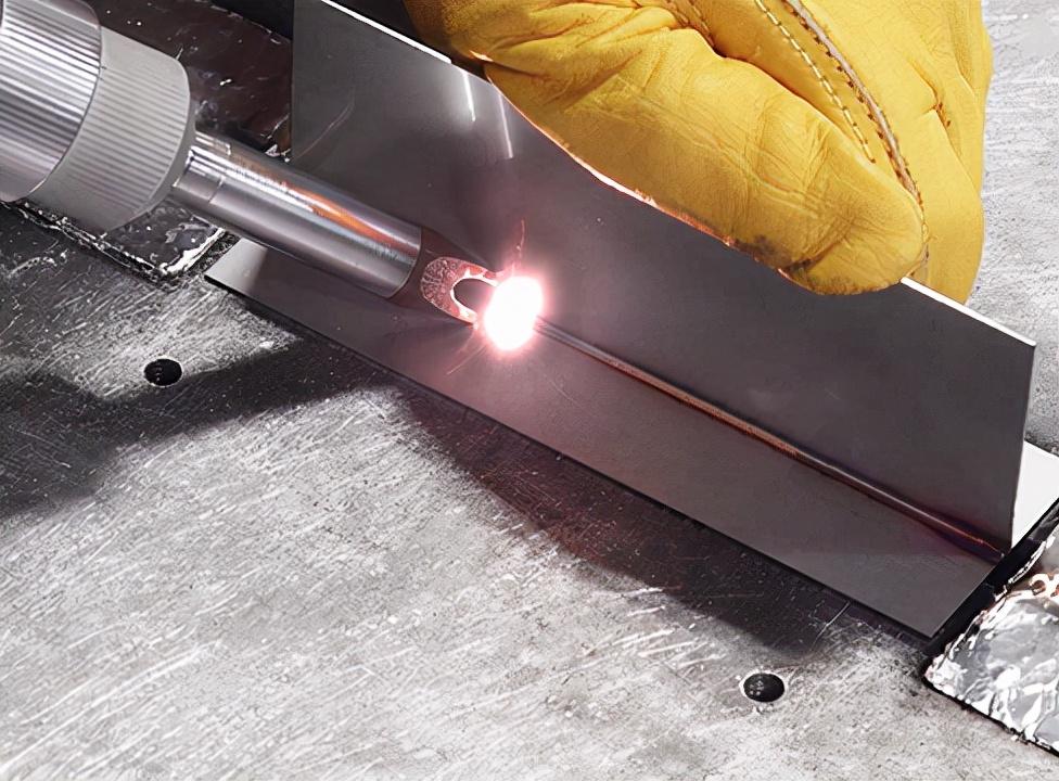 Operator performing high-speed, deformation-free butt welding on thin sheet metal with a Magick handheld fiber laser welder.